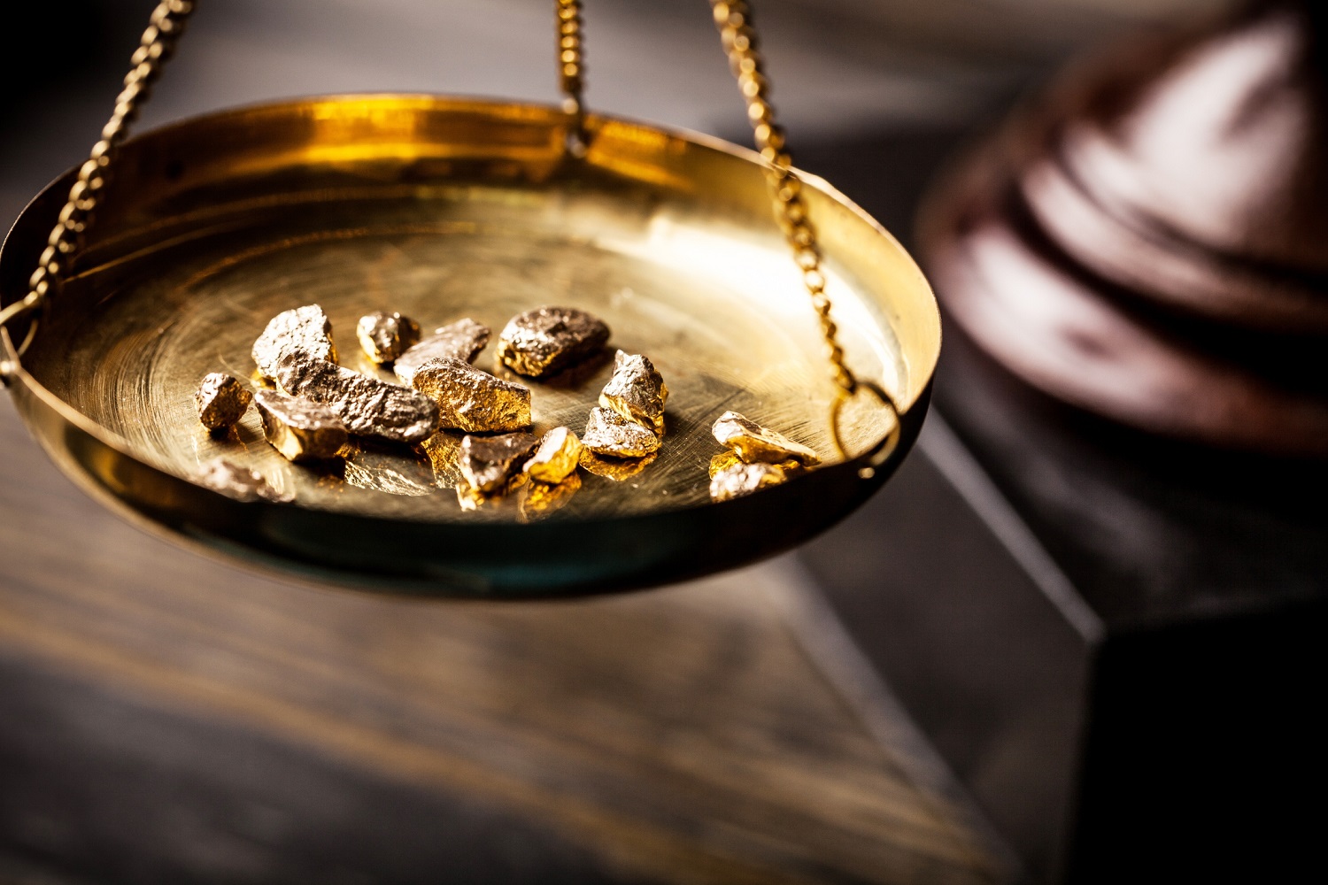 Small gold nuggets in an antique measuring scale at Breckenridge Historic District