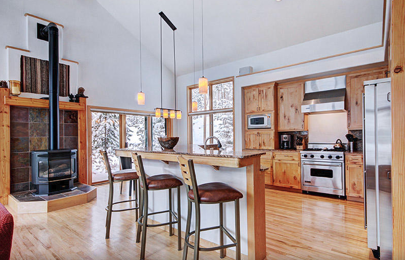 View of the kitchen and dining room of the property - wooden details and high ceilings